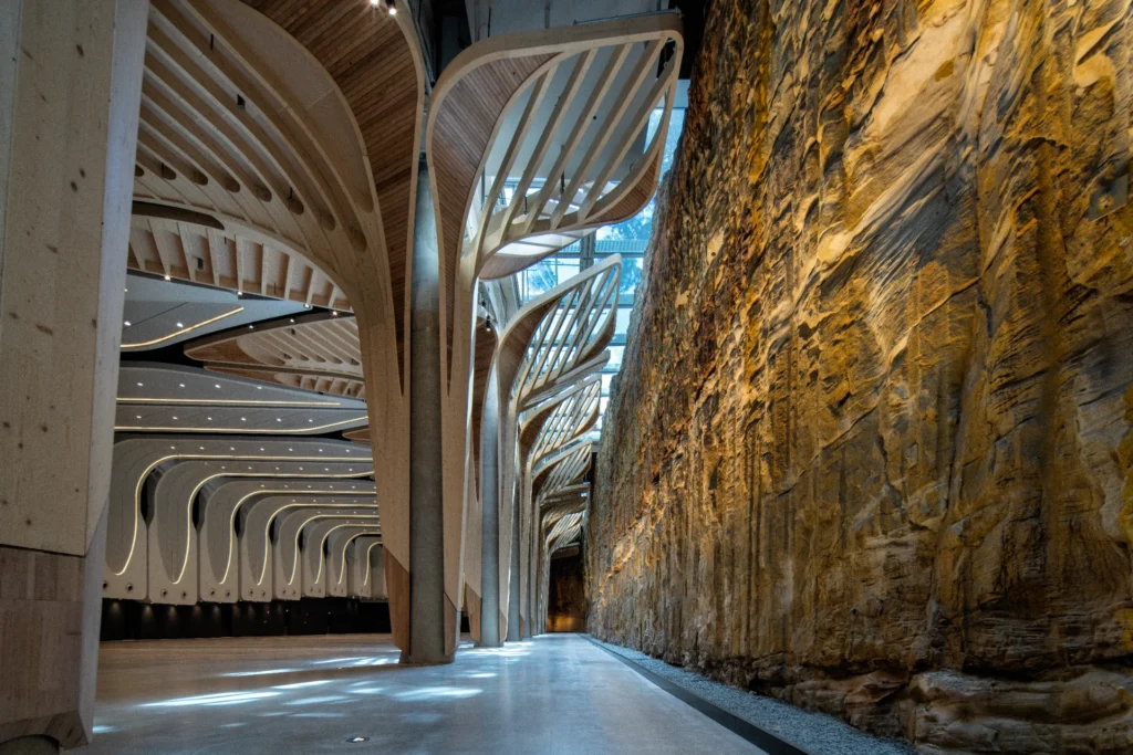 The Cutaway walkway beside towering sandstone rock face and timber ribs