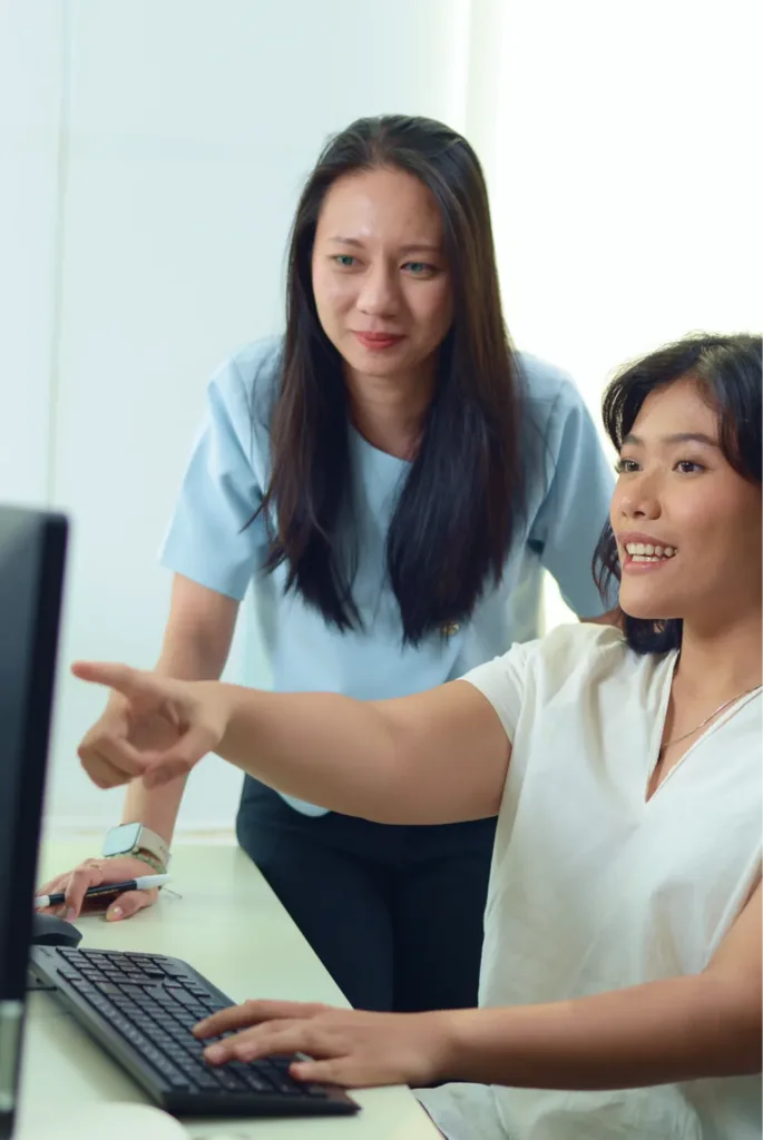 TTW colleagues discussing work in the Jakarta office